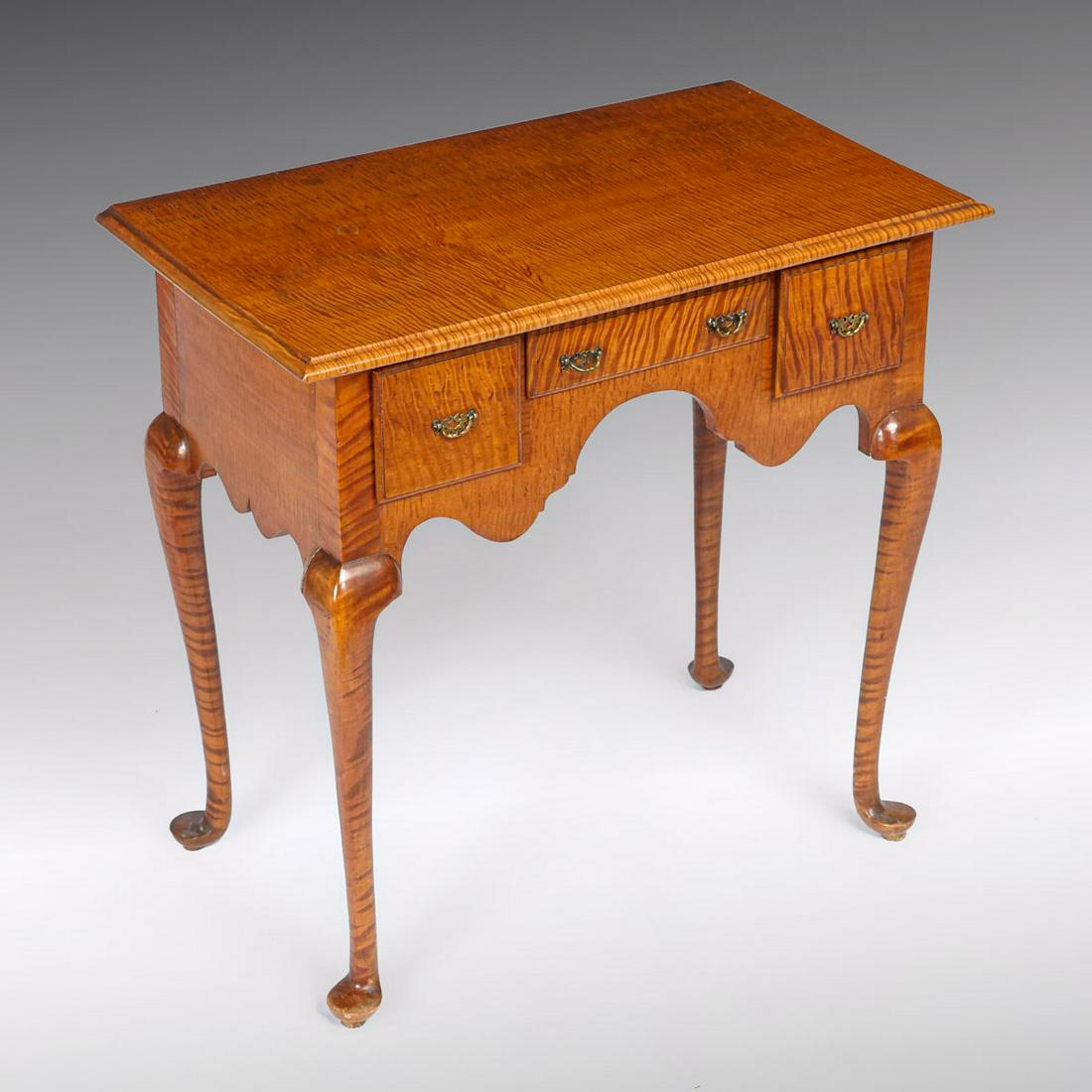QUEEN ANNE TIGER MAPLE LOW BOY: QUEEN ANNE TIGER MAPLE LOWBOY QUEEN ANNE TIGER MAPLE LOW BOY: Beautifully grained Queen Anne Tiger maple low boy, having 3-drawers with brass drop handles, over a shaped crotch. Raised on cabriole leg