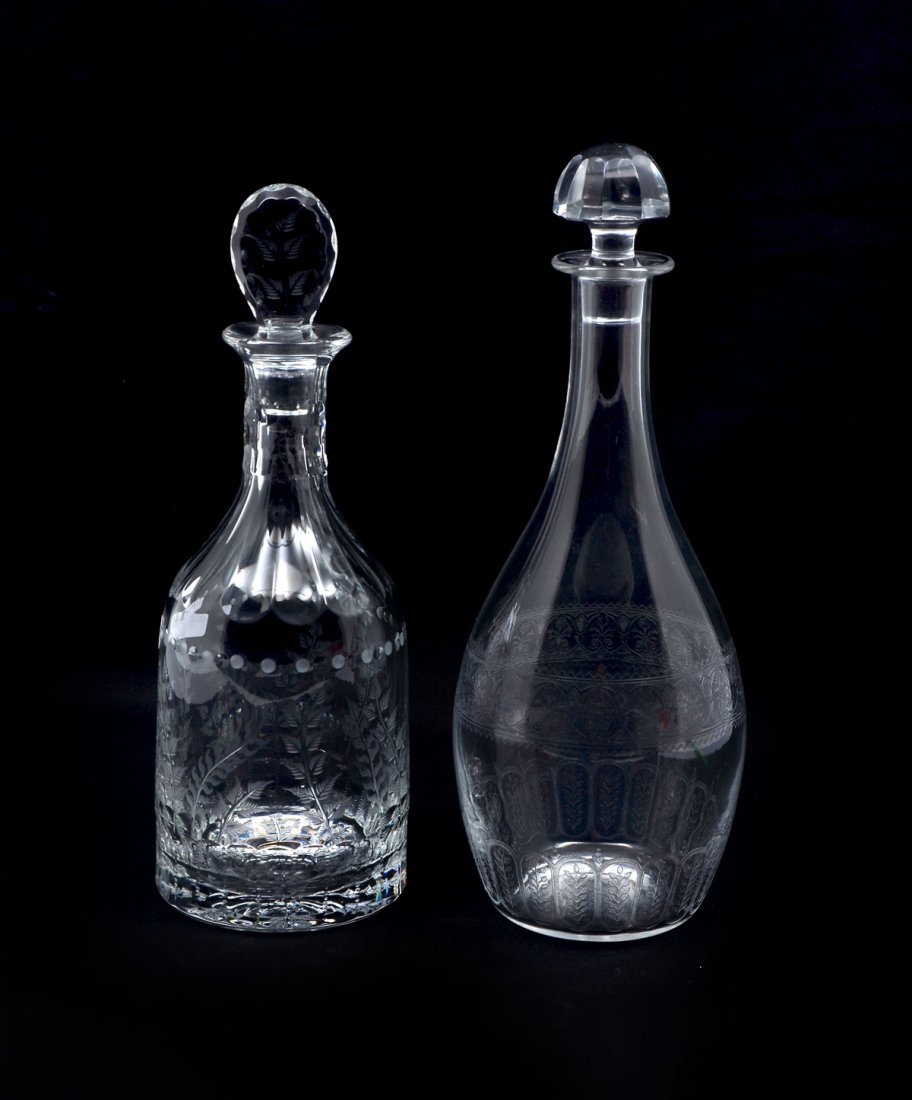2 ENGRAVED BACCARAT DECANTERS: 2 ENGRAVED WILLIAM YEOWARD BACCARAT DECANTERS: Comprising; 1- Baccarat decanter, having an encompassing floral medallion design and foliate vinesat bottom. 1- William Yeoward decanter having an encomp