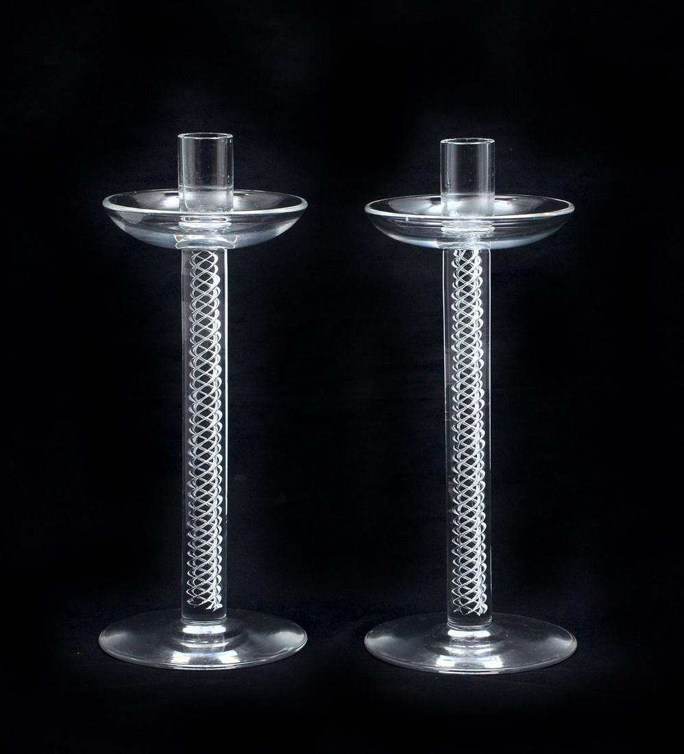 PAIR OF STEUBEN AIRTWIST CANDLESTICKS: PAIR OF STEUBEN AIRTWIST CANDLESTICKS: 2 Steuben art glass candlesticks, having 4 controlled air twist bodies. Approx. 11.25'' h x 4.5'' w.