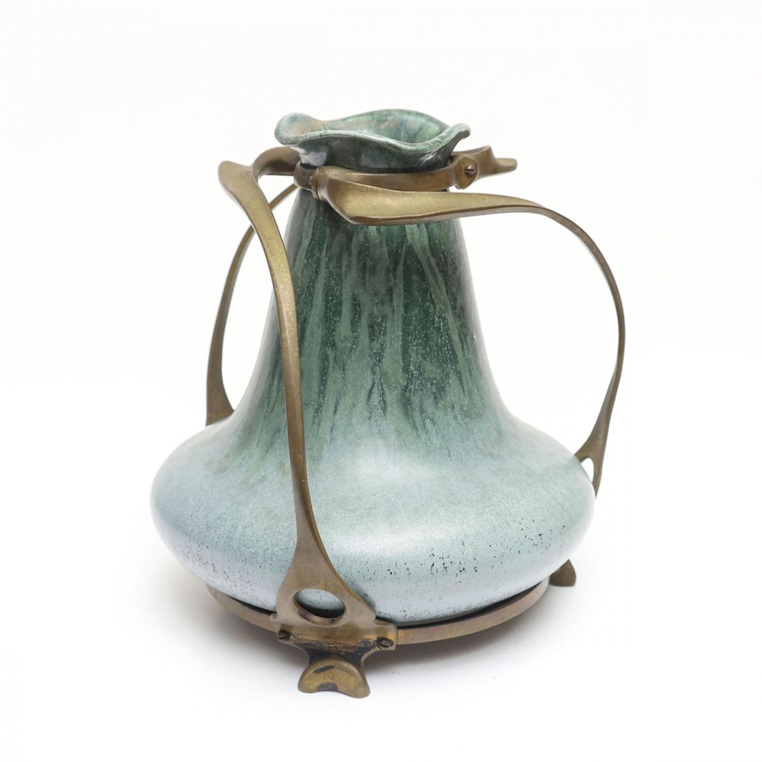 ART POTTERY VASE MOUNTED IN BRONZE: ART POTTERY VASE MOUNTED IN BRONZE: The Nouveau Era Art Pottery vase has a Fulper style matte finish glaze shaded dark to light green then to blue in metal mounted in a classic Nouveau style framework