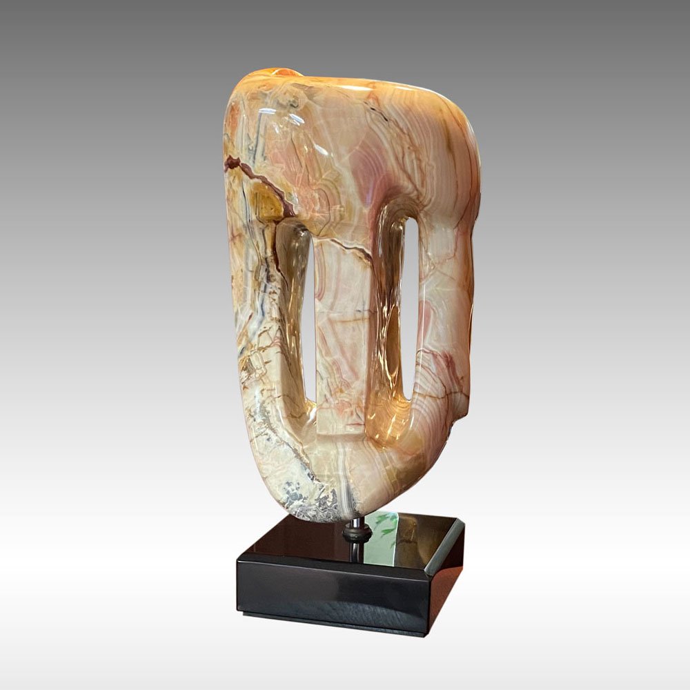 ANTHONY QUINN ABSTRACT FORM MARBLE SCULPTURE: QUINN, Anthony, (Mexican, 1915-2001): Abstract Composition Marble, 22.5" in height, incised signature inset in custom black marble plinth, 25" overall, sold with a custom carved wooden stand that is 2