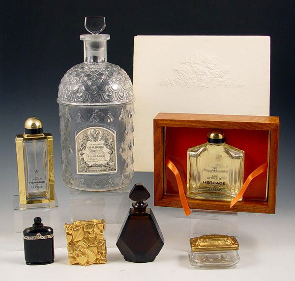 GUERLAIN PERFUME COLLECTION 7 PC BOOK BOTTLES: GUERLAIN PERFUME BOTTLE COLLECTION PLUS BACCARAT: To include 1) Deep smoke Baccarat bottle (5"). 2) Guerlain Heritage in wooden case decorated with a copy of an 1889 painting of the Guerlain factory a