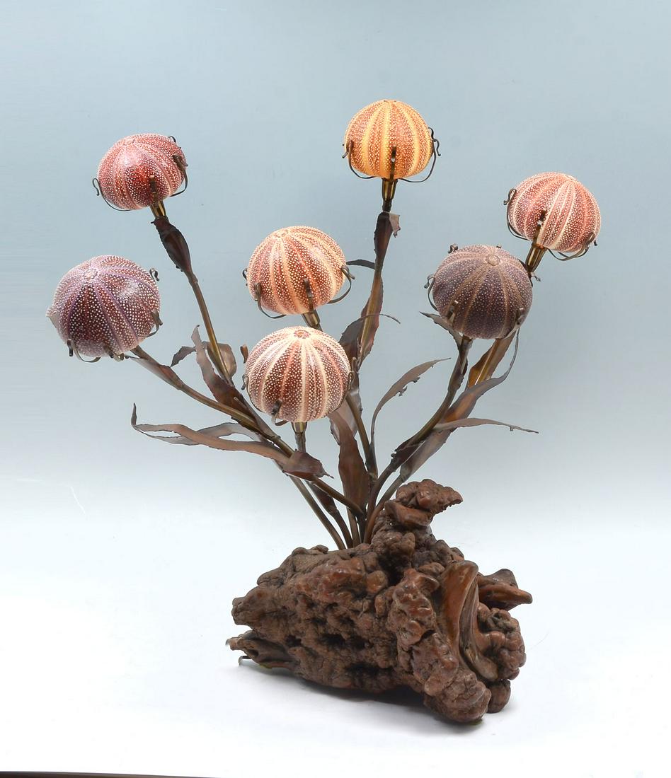 JERE STYLE MID-CENTURY MODERN SEA URCHIN LAMP: CURTIS JERE STYLE MID-CENTURY MODERN SEA URCHIN LAMP: 1960-70's Curtis Jere 7-light lamp, having a burlwood base with copper foliate. Surmounted by 7- real Sea Urchin shells as shades. Also included a