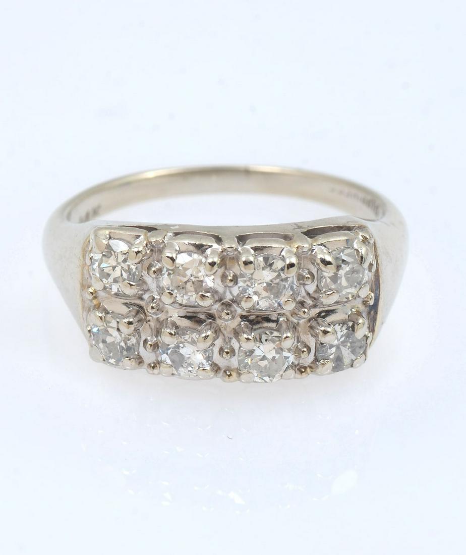 1.25CTW 14K RETRO 2 ROW DIAMOND RING: 1.25CTW 14K RETRO 2 ROW DIAMOND RING: 8 bead set circular brilliant cut diamonds are SI in clarity and set in 2 rows of 8 in this 14K white gold ring. Size 7.25. Weight 4.67 grams. Marked 14K and Happ