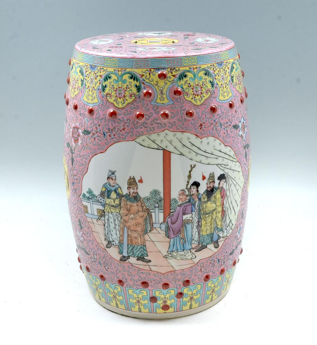 CHINESE FAMILLE ROSE GARDEN SEAT: CHINESE FAMILLE ROSE GARDEN SEAT: Chinese Famille Rose, Pink ground garden seat, having 2- windows with a figural palace scene. Encompassing scrolling design and floral & foliate accents. Approx. 19''
