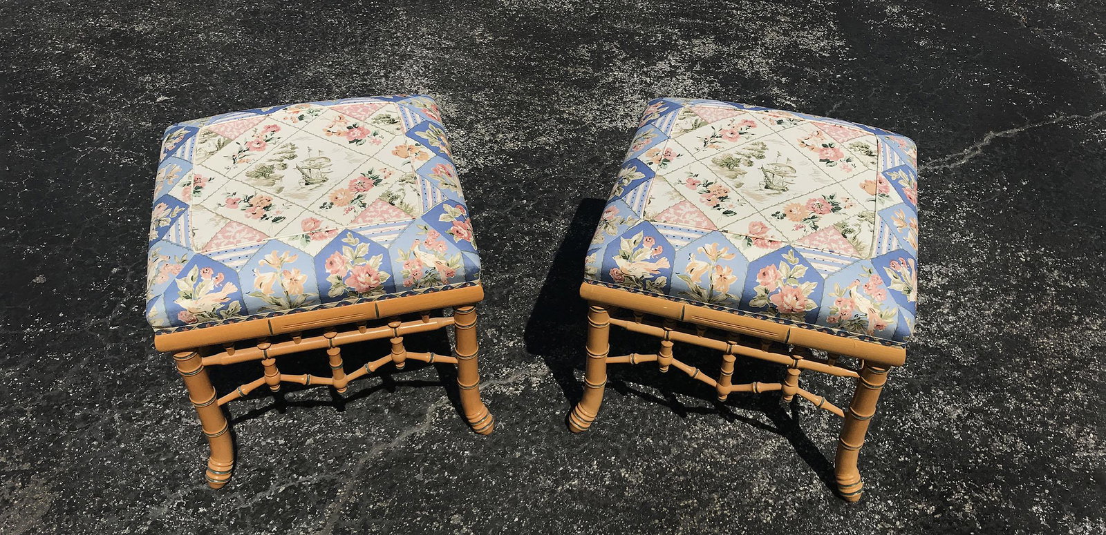 2 BAMBOO STYLE STOOLS: 2 BAMBOO STYLE STOOLS: 2- stools, having a faux bamboo frame. Upholstered in a floral & bird pattern with a central sailing ship. Approx. 18'' h x 19.5'' l x 19.5'' w.