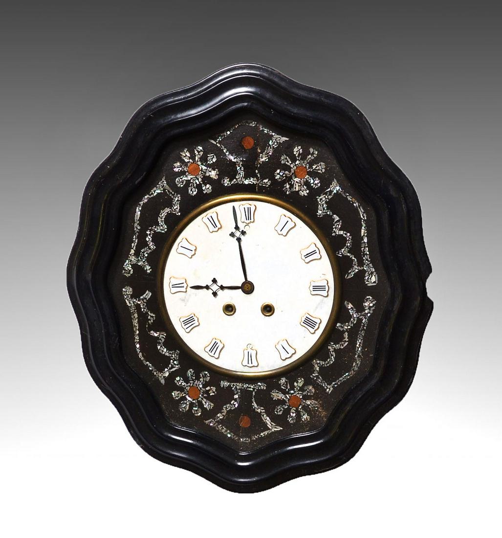 BLACK LACQUERED MOTHER OF PEARL INLAYED CLOCK: BLACK LACQUERED MOTHER OF PEARL INLAYED CLOCK: 19th century French ebonized clock with inlaid Mother of Pearl & wood. Marble face under glass. Approx. 23'' h x 20'' l x 5.25'' w.