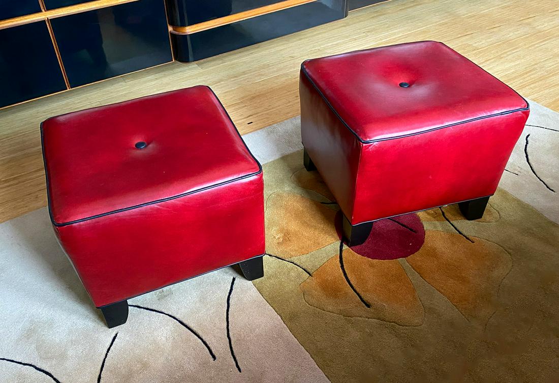 PAIR OF THOMASVILLE RED LEATHER STOOLS: PAIR OF THOMASVILLE RED LEATHER STOOLS: Pair of red leather foot stools with black trim, by Thomasville. Approx. 17'' h x 20.5'' l x 20.5'' w.