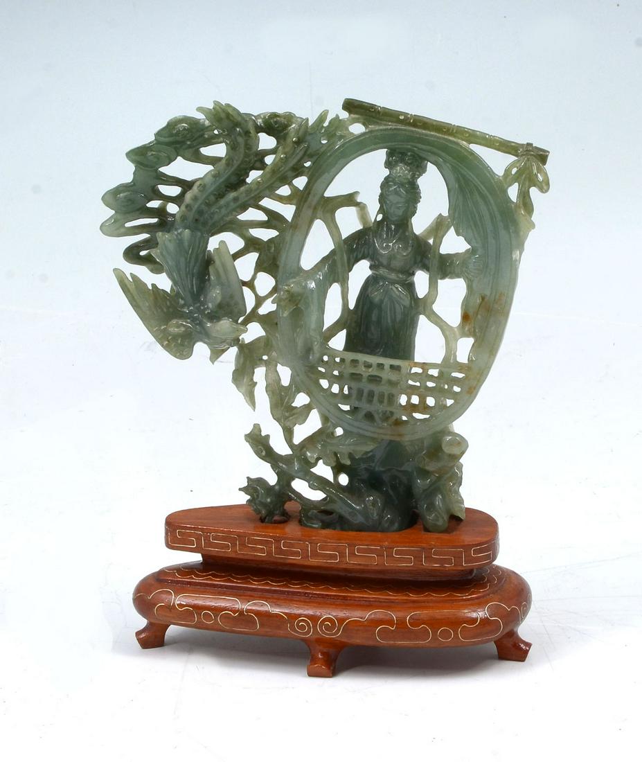 CARVED JADE GEISHA & PHOENIX ON STAND: CARVED JADE GEISHA & PHOENIX ON STAND: Chinese carved green jade in the form of a young Geisha feeding a Phoenix through a window. Resting on a wire inlaid stand. Approx. 5.75'' h x 4.5'' l x 1.75'' w