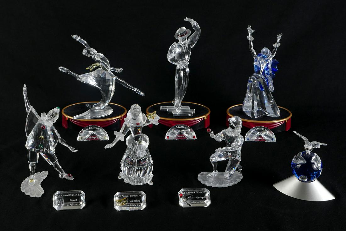 7 PC. SWAROVSKI FIGURINES WITH STANDS: 7 PC. SWAROVSKI FIGURINES WITH STANDS: Comprising; 1- ''Anna'' figure with crystal name plate. On Jeweled stand. 1- ''Isadora'' ballet figure with crystal name plate. On a jeweled stand. 1- ''Columbin