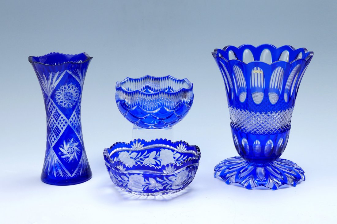 4 PC. BLUE CUT TO CLEAR BOHEMIAN CRYSTAL: 4 PC. BLUE CUT TO CLEAR BOHEMIAN CRYSTAL: Comprising; 1- Large footed vase, 1- Center bowl with a fish scale design, 1- Tall vase, & 1- Center bowl with an encompassing floral & foliate design. Larges