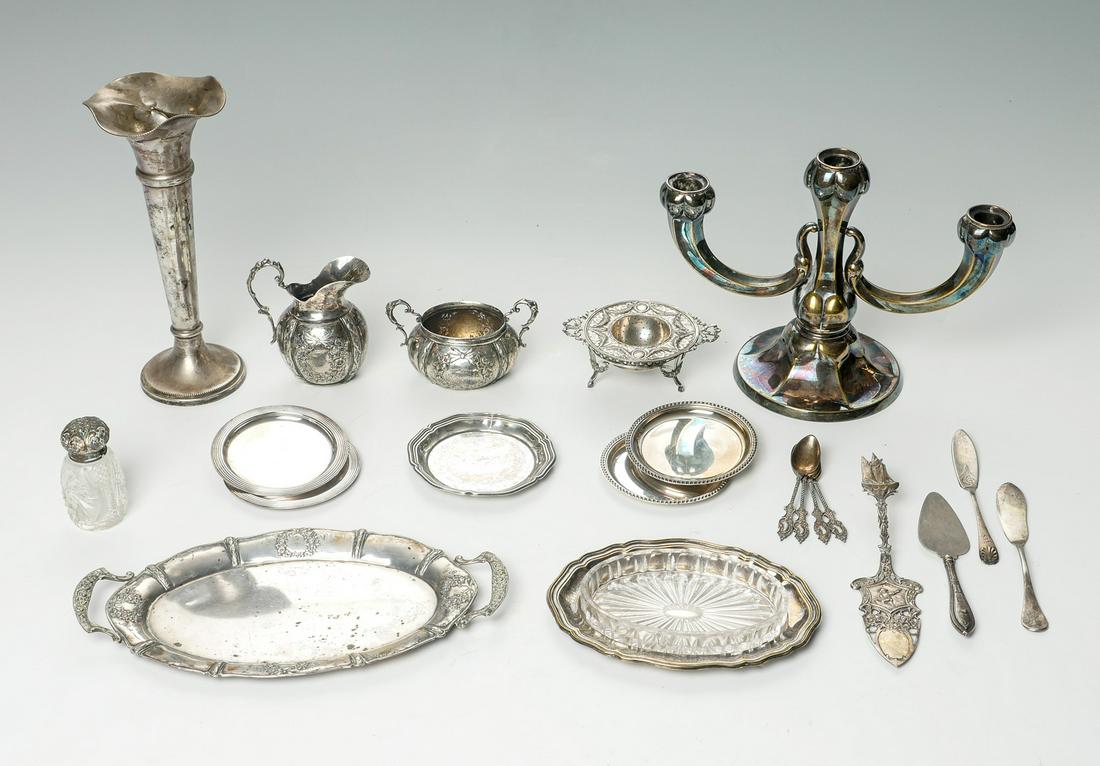 22 PC. MISC. GERMAN SILVER & SILVER PLATE: 22 PC. MISC. GERMAN SILVER & SILVER PLATE: Approx. 17.42 Troy ounces. Comprising; Candlestick, vase saltshaker, small serving trays, flatware, vase, and a matching sugar & creamer. Largest Approx. 9.7