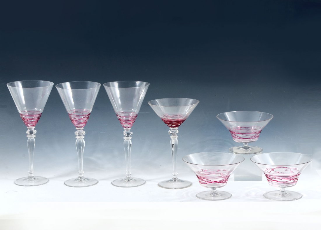7 STEUBEN SWIRL STEMWARE: 7 STEUBEN SWIRL STEMWARE: Comprising; 3- 9" Wine glasses, 1- 7.5" Wine glass, & 3- 3.25" h Footed Ice Cream bowls. All by Steuben, having vertically ribbed stems and attached Pink thread work.