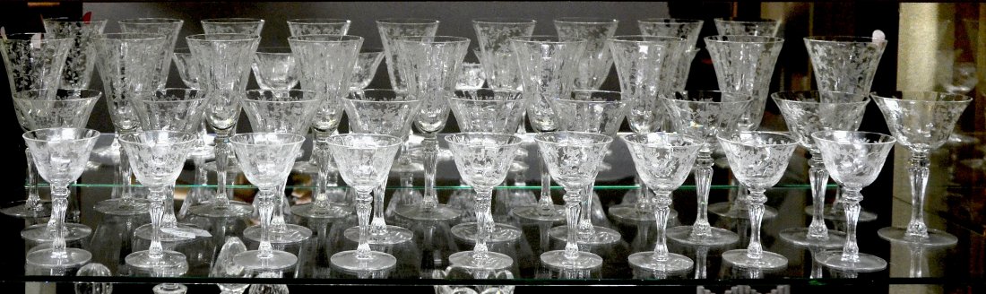 25 PC. ENGRAVED CRYSTAL STEMWARE: 25 PC. ENGRAVED CRYSTAL STEMWARE: Comprising; 9- Tall water glasses Approx. 8" h, 6- Wine glasses Approx. 6" h, & 10- Cordials Approx. 4.75" h. All having a paneled body with etched Rose & foliate des