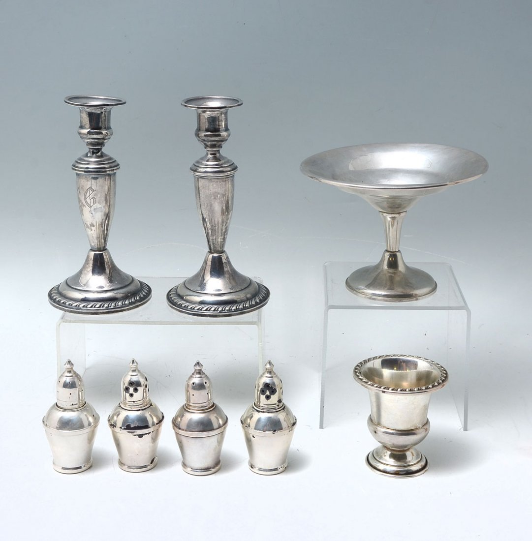 8 PC. STERLING SILVER COLLECTION: 8 PC. STERLING SILVER COLLECTION: Comprising; 1- Rodgers Toothpick holder, 1- Tazza/Compote, 1- Pair of Candlesticks, & 2- Pairs of Salt & Pepper shakers with glass interiors. Largest Approx. 6.25" h