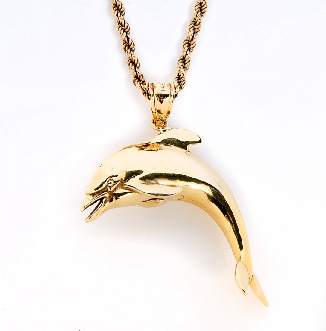 14K DOLPHIN PENDANT WITH CHAIN: 14K DOLPHIN PENDANT WITH CHAIN: 1) 14K yellow gold dolphin measures 1.25" h x 1.5" w; weighs 10.1 grams; 2) 24" yellow gold rope necklace; Weight 11.3 grams.