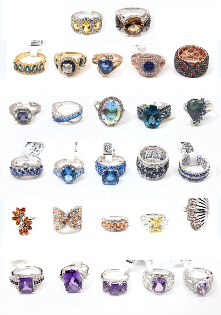 27 STERLING RINGS: 27 STERLING RINGS: A beautiful mix of sterling rings - some with CZ or gemstones. 1 10K ring. Sizes vary. Weight approximates 140 grams.