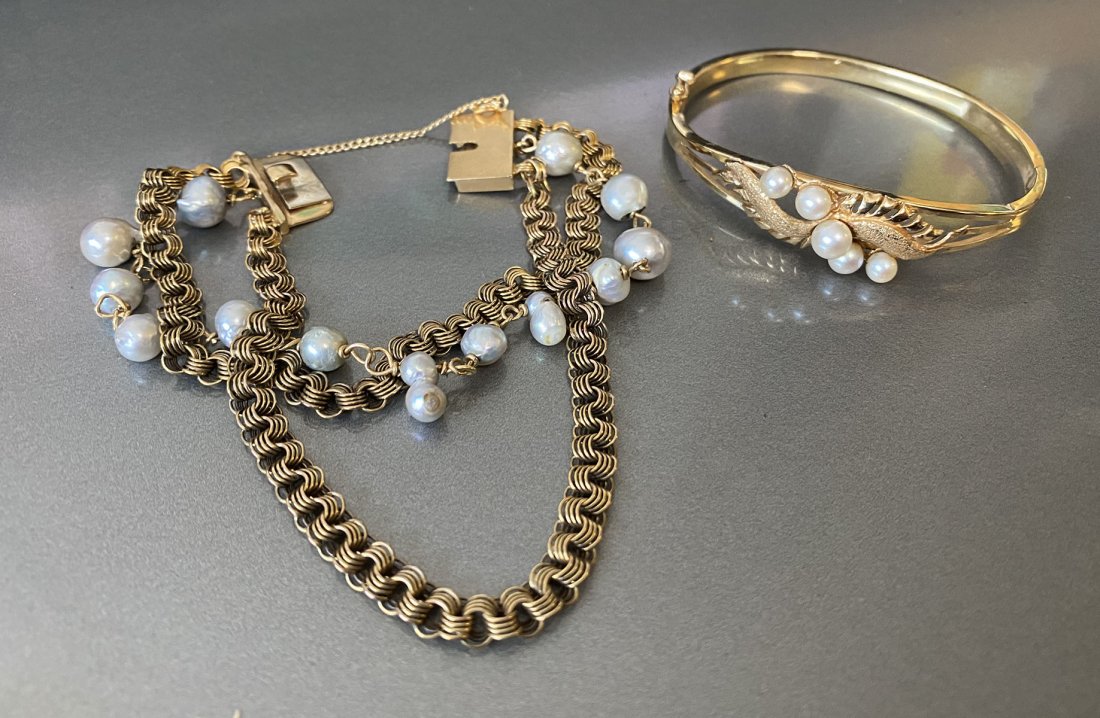 2 LOVELY ESTATE 14K GOLD AND PEARL BRACELETS: 2 LOVELY ESTATE 14K GOLD AND PEARL BRACELETS: 1) 3 Strand Gold and Pearl Bracelet, 1 strand of Pearls and the other 2 of Chain Link. 7 in length; 2) 14K yellow gold and brushed gold leaf motif with pe