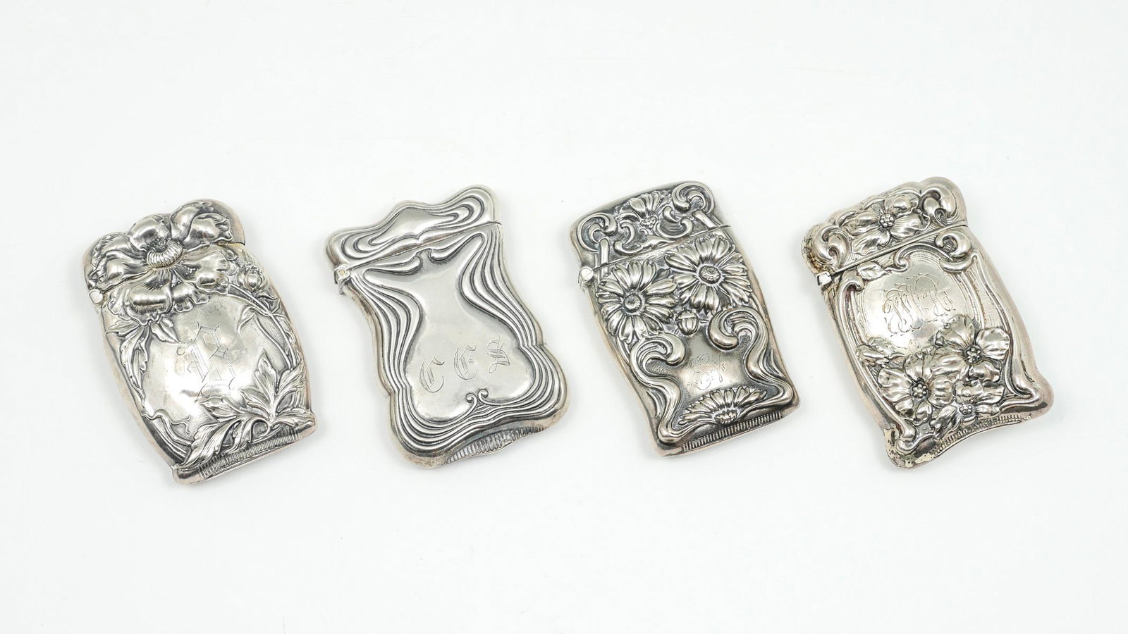 4 PIECE ART NOUVEAU STERLING MATCHBOOK CASES: 4 PIECE ART NOUVEAU STERLING MATCHBOOK CASES: Approx. 2.82 Troy ounces. 4- Victorian Art nouveau Sterling silver matchbook safes. All marked Sterling. 1- made by Webster Co. All are monogrammed. Large