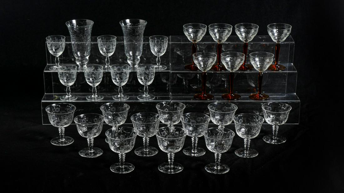 28 PIECE ETCHED GLASS STEMWARE COLLECTION: 28 PIECE ETCHED GLASS STEMWARE COLLECTION: Comprising; 12- Sherberts with a floral design, 7- Amber stem wine glasses, 2- Foliate designed water glasses, & 7- Etched floral cordials. Largest Approx. 6