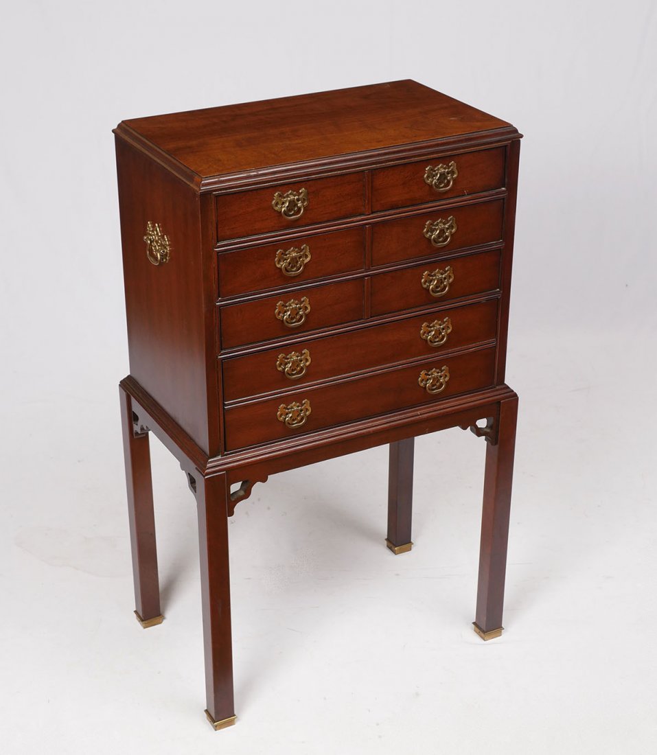 4-DRAWER THOMASVILLE SILVER CHEST ON STAND: 4-DRAWER THOMASVILLE SILVER CHEST ON STAND: 3- drawer over 1- deep drawer, silver chest mounted on a stand with square legs & brass mounted feet. Top drawer has a Thomasville burned stamp. Approx. 38.