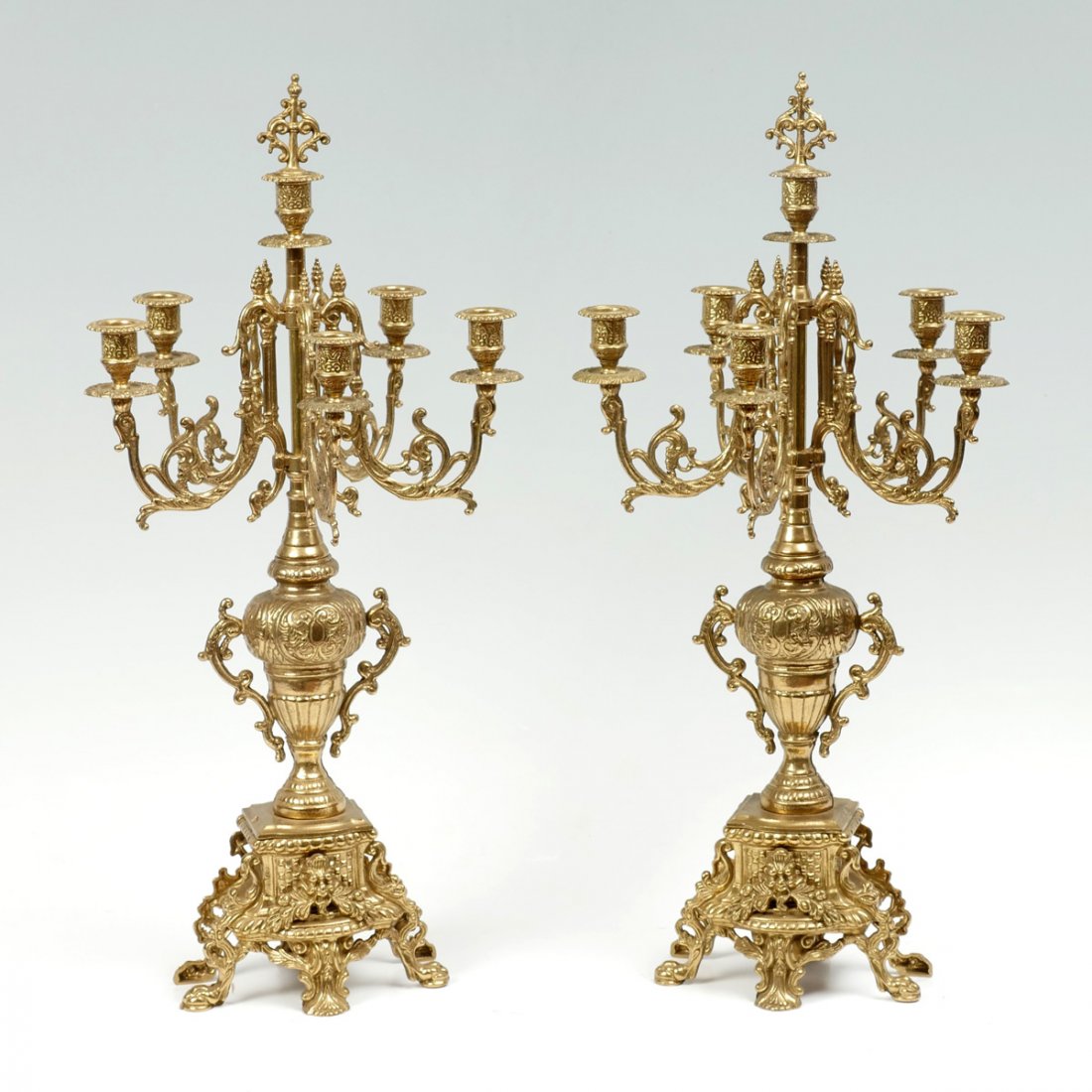 PAIR OF BRASS GREENMAN CANDELABRA: PAIR OF BRASS GREENMAN CANDELABRA: 2- French style brass 6- light candelabra, having an overall scrolling foliate design with a Greenman masque. Approx. 26.5" h x 12.25" w.