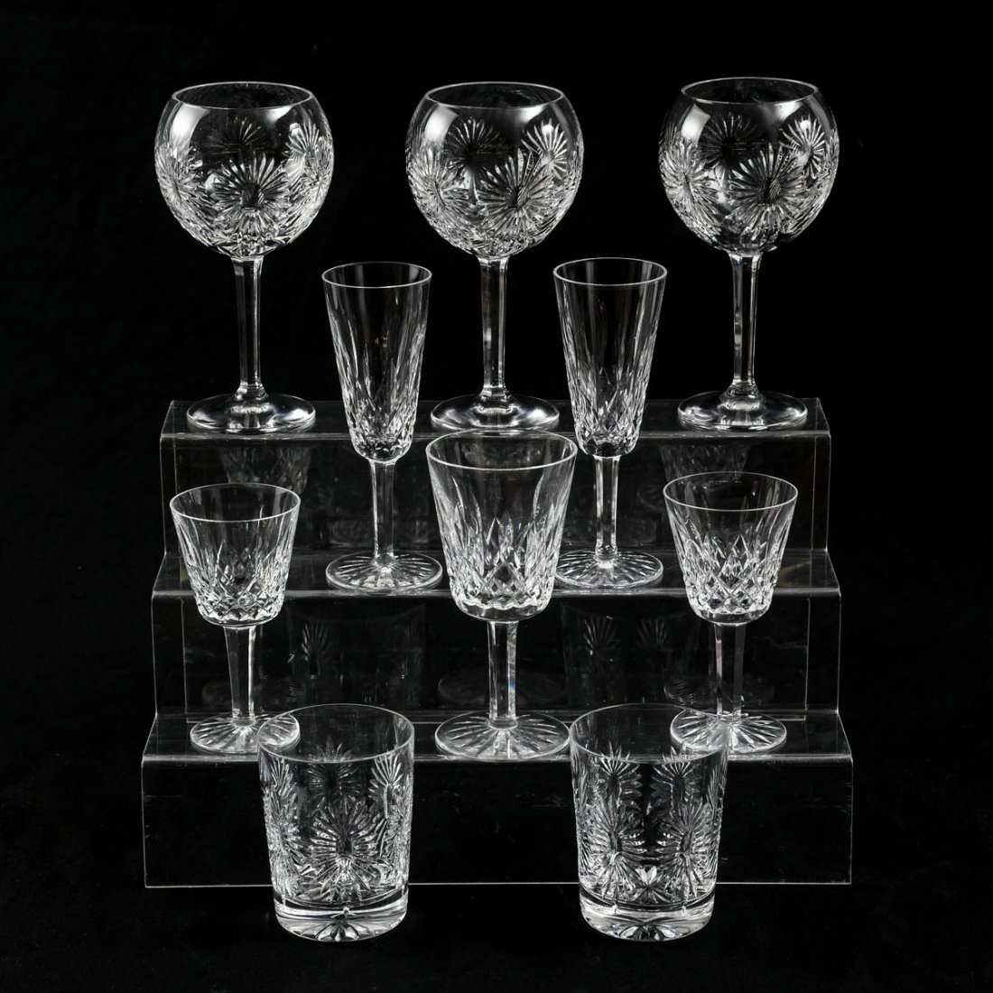 10 PIECE WATERFORD COLLECTION: 10 PIECE WATERFORD COLLECTION: Comprising; 2- Rocks glasses, 3- large wine glasses, 1- water glasses, & 2- champagne flutes, & 2- goblets. All by Waterford, signed at foot. Largest Approx. 8" h x 4.25