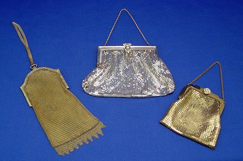 3 WHITING & DAVIS MESH PURSES: 3 WHITING & DAVIS MESH PURSES: Deco bag of gold metal with shaped frame etched in a floral motif, mesh wrist handle, pressure clasp set with blue cabochon. Bag 7 1/2"l. plus 1" fringe and 6" handle, 3