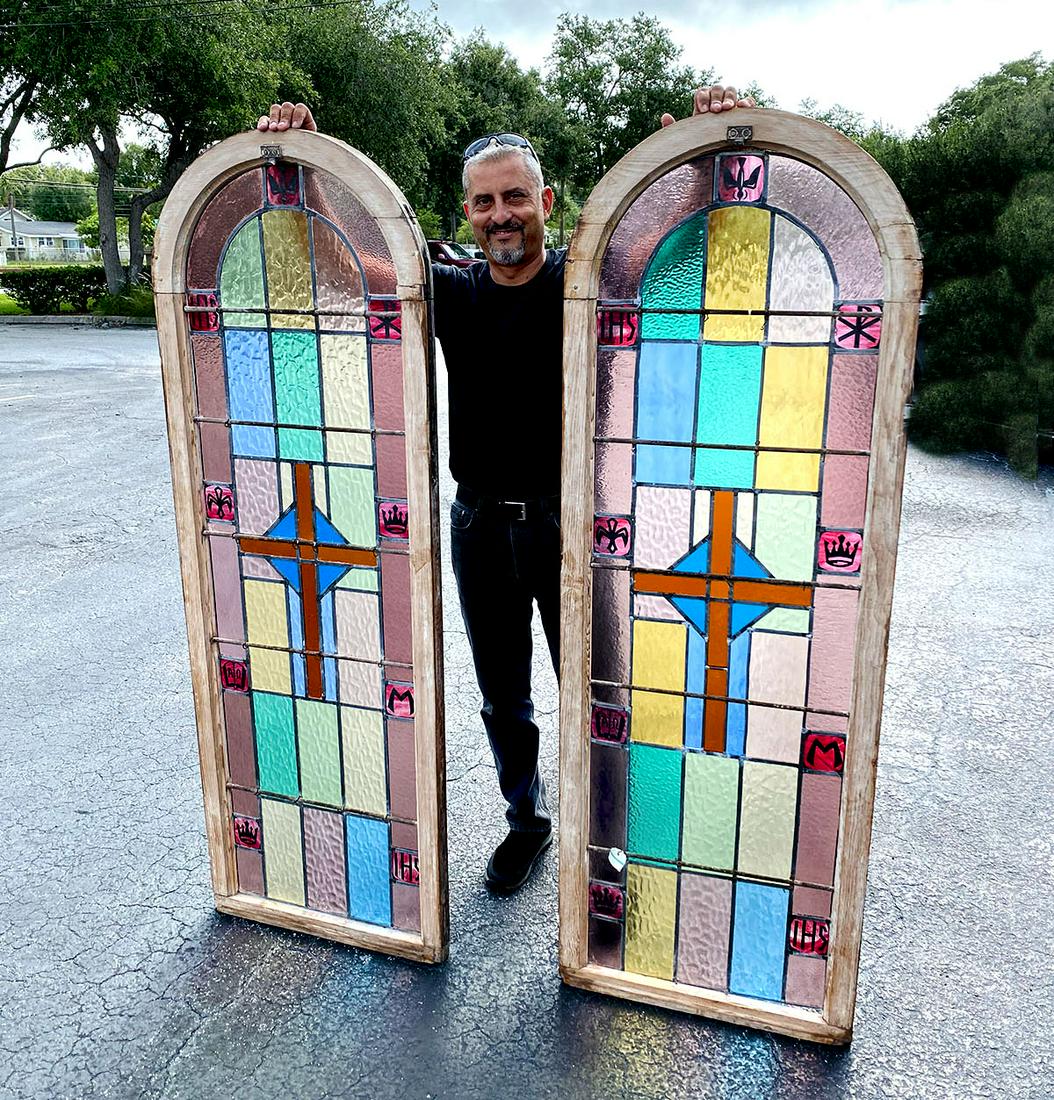 2 LEADED GLASS CHURCH WINDOWS: 2 LEADED GLASS CHURCH WINDOWS: 2- Arch form religious colorful stained glass windows with a cross in center. 8- Religious symbols at each window. Glass rattles when tapped. Approx. 69.5'' h x 24'' l x