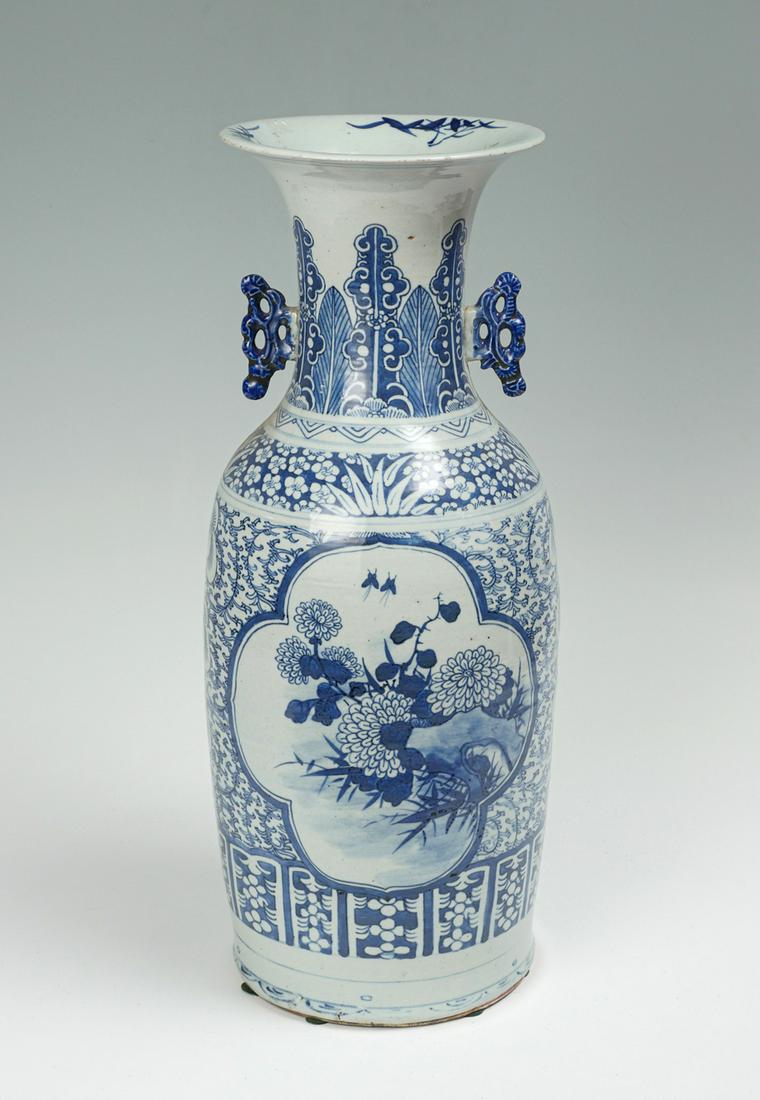 TALL 19TH CENTURY CHINESE BLUE AND WHITE VASE: TALL 19TH CENTURY CHINESE BLUE AND WHITE VASE: Qing dynasty period Chinese blue & white vase, having a scrolling foliate & floral design with windows having blossoming floral scenes. Attached handles 