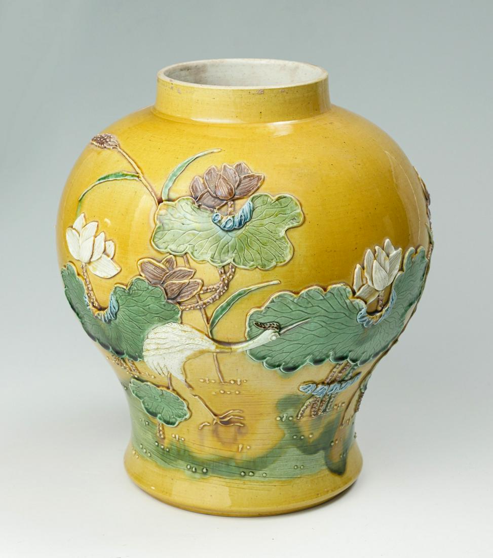 YELLOW CHINESE WANG BING RONG SIGNED VASE: YELLOW CHINESE WANG BING RONG SIGNED VASE: Polychromatic yellow ground vase, having a Crane amongst Pond foliate design. All in relief. Raised mark at underside reads, Wang Bing Rong Zhi (Wang Bing Ro