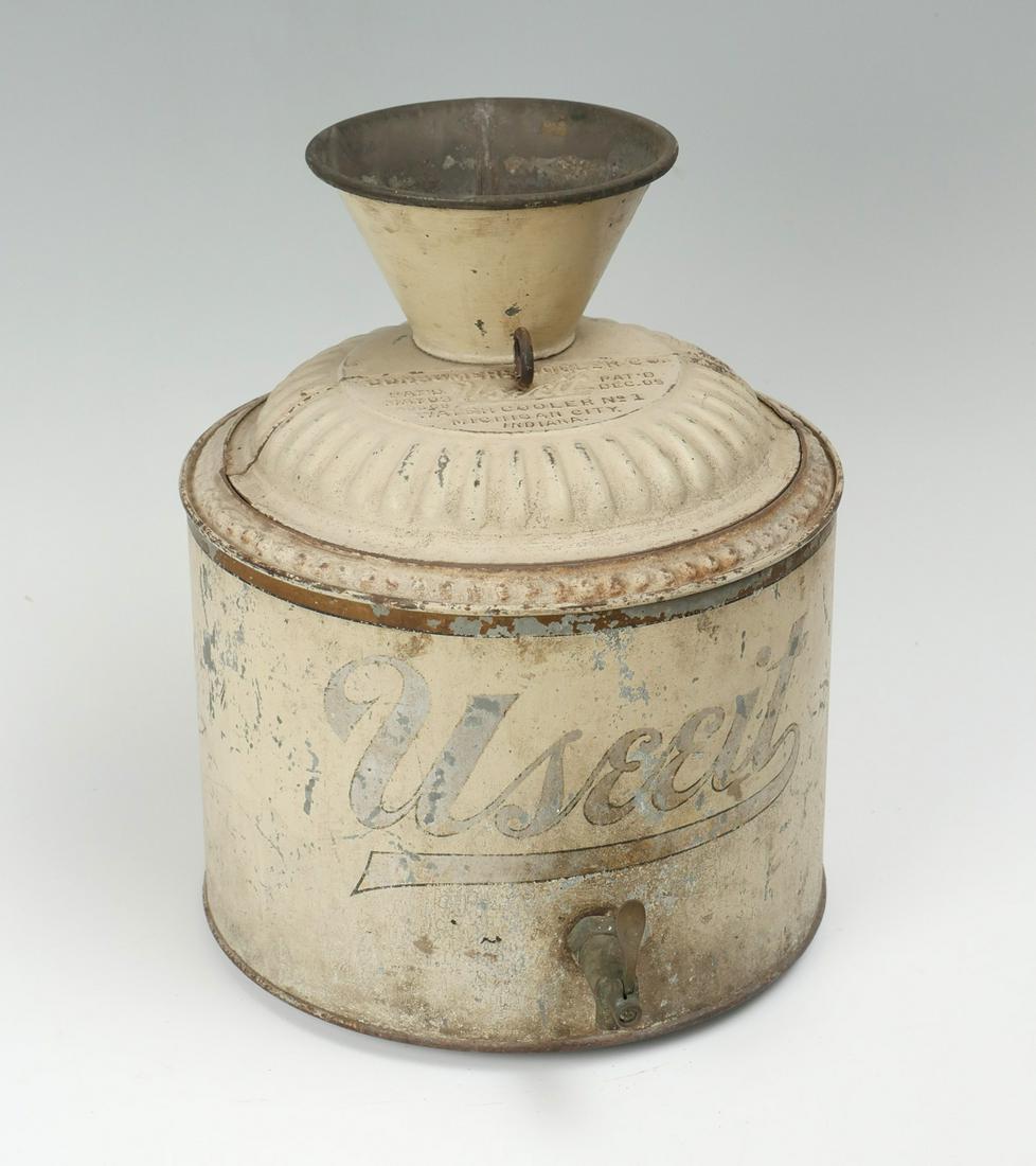CONSUMERS COOLERS CO. USEEIT WATER COOLER NO. 1: CONSUMERS COOLERS CO. "USEEIT" WATER COOLER NO. 1: Water cooler, mfgd by Consumer Cooler Co.-Michigan City, IN, patd 1903, metal dispenser. Faded off-white painted body with "Useeit" at the observe. A