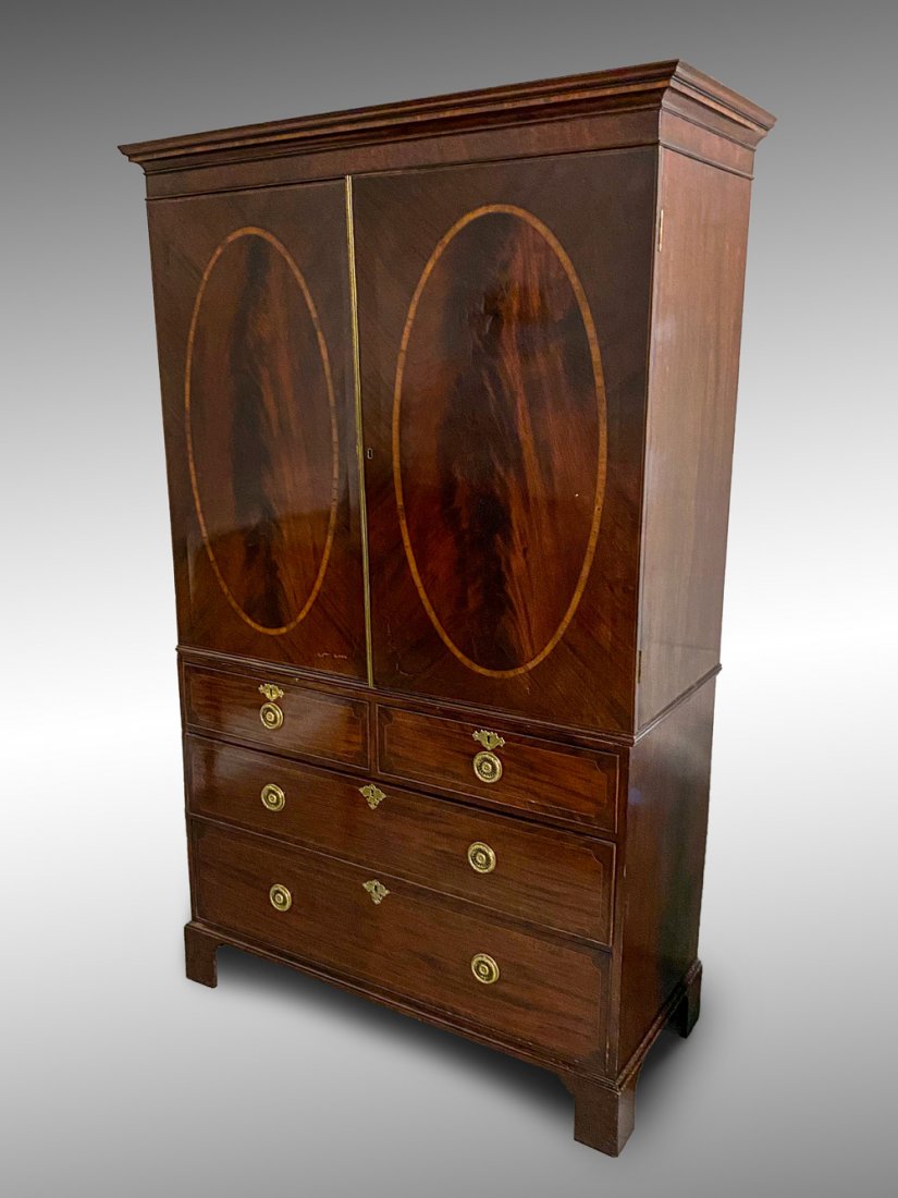 2 DOOR OVER 4 DRAWER HEPPLEWHITE LINEN CHEST: 2 DOOR OVER 4 DRAWER HEPPLEWHITE LINEN CHEST: South Carolina Hepplewhite Linen chest, having 2- doors with inlaid ovals, over 4- drawer chest. Raised on bracket feet. Replaced wreath form drop handles