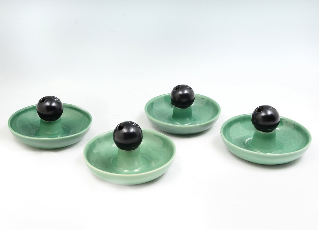 4 PC. ROOKWOOD PROTOTYPE ASHTRAYS: 4 PC. ROOKWOOD PROTOTYPE ASHTRAYS: 4- Rookwood ashtray Prototypes, having a bakelite cigarette snuffer in center. Impressed marks at undersides. Approx. 3.5" h x 6.25" w.