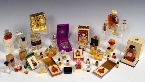 COLLECTION OF VINTAGE PERFUME BOTTLES: COLLECTION OF VINTAGE PERFUME BOTTLES: Assorted sizes by assorted makers to include, Coco Chanel, Guerlain, Coty, Balenciaga, Marcel Rochas, Arpege by LanVin, Ciro, Joy by Jean Patou, Fracas by Robert