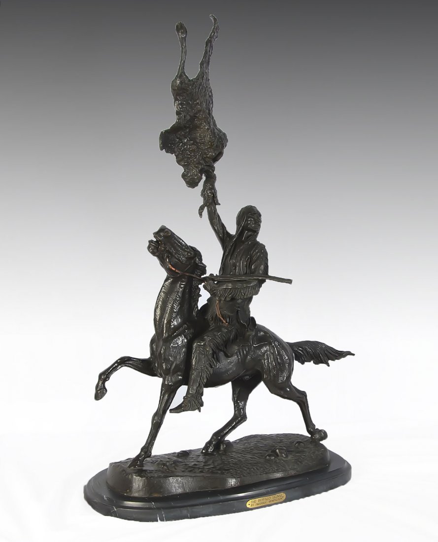 BUFFALO SIGNAL BRONZE AFTER FREDRICK REMINGTON: LARGE BUFFALO SIGNAL BRONZE AFTER FREDRICK REMINGTON: Depicts an Indian Brave on Horse Back Waving Animal Hide as a Signal to His Tribe, Bronze, 35'' in height, affixed to a beveled marble plinth.
