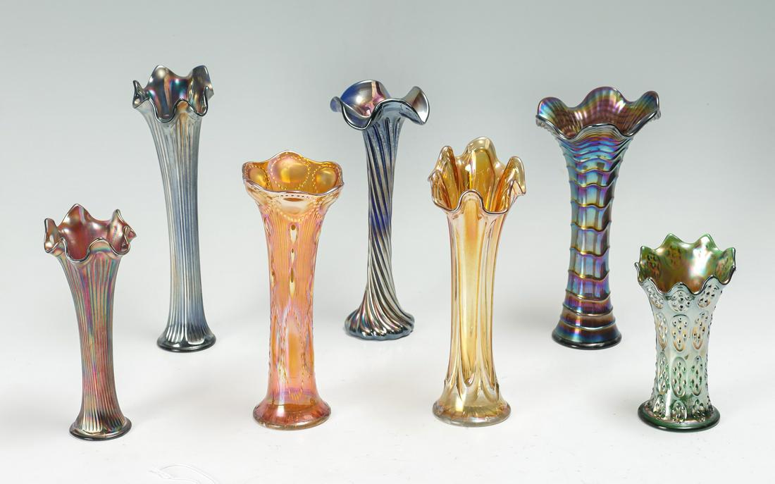 7 PC. CARNIVAL GLASS VASE COLLECTION: 7 PC. CARNIVAL GLASS VASE COLLECTION: 1) Imperial Ripple Carnival Glass Vase Purple/Blue Opalescent, 12" h x 3.5" base; 2) Fenton Iridescent/Opalescent Orange Carnival Glass Vase, 12" h. x 3.25" base;