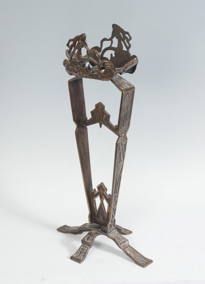 OSCAR BACH STYLE ART DECO STAND: OSCAR BACH STYLE ART DECO FISHBOWL STAND: Art Deco cast Iron fishbowl stand with surmounting Mermaids. Decorated with stylized deco storks & insects. Approx. 34" h x 18" l x 12.5" w.