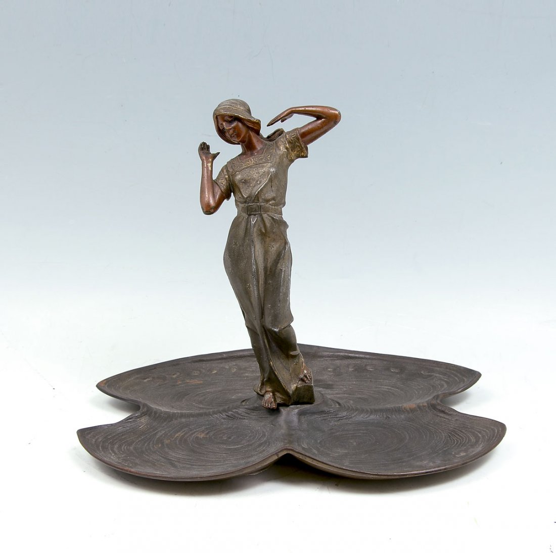BRONZE AND PATINATED METAL SCULPTURE OF A MAIDEN: BRONZE AND PATINATED METAL SCULPTURE OF A MAIDEN: Patinated Spelter, Young Maiden Resting atop Lilly Pad Style Base, 12" in height.