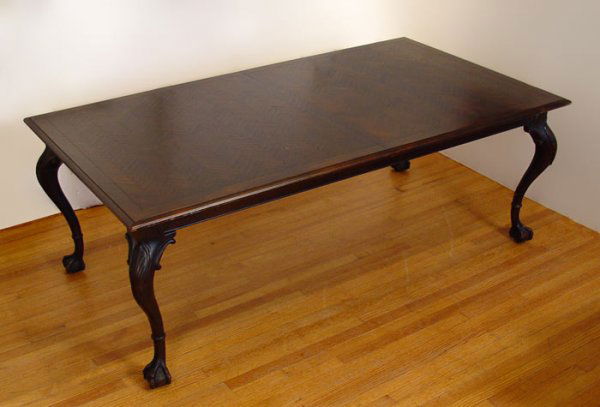 10 ft MAHOGANY DINING TABLE: PARQUETRY MAHOGANY DINING TABLE: On ball & claw feet. With 2 leaves in place the table extends to 10 ft. Measures 29 1/2'' high x 81 1/2'' x 44 3/4'', 2 leaves measures 20'' wide each. Finish in need