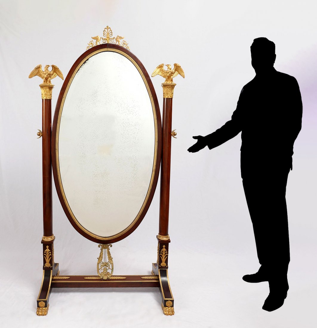CLASSICAL EMPIRE CHEVAL MIRROR: CLASSICAL EMPIRE CHEVAL MIRROR: Mahogany frame with ormolu trim, foliate mounts, & Eagle finials. Large beveled mirror with surmounting gryphons & scrolling foliate. All raised on paw feet. Approx. 76