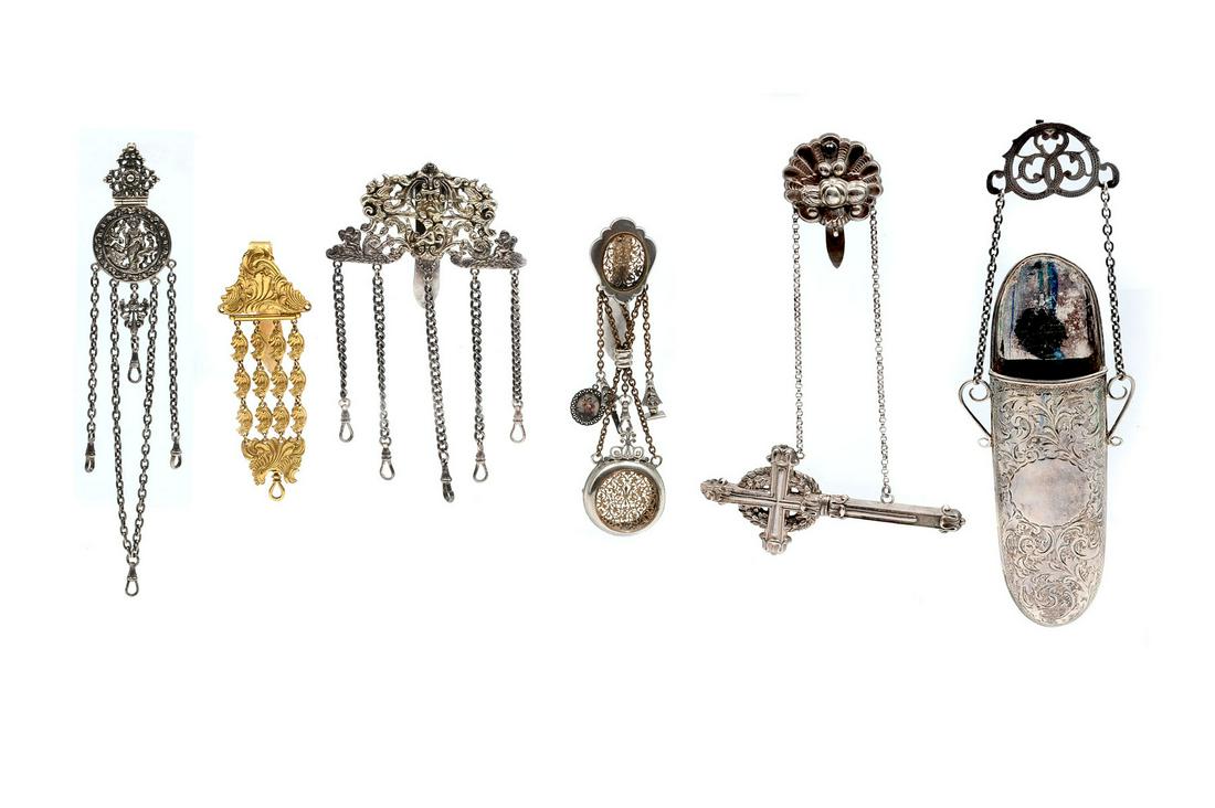 6 PC. VICTORIAN CHATELAINE COLLECTION INCLUDING: 6 PC. VICTORIAN CHATELAINE COLLECTION INCLUDING EYEGLASS CASE: Approx. 4.91 Troy ounces .925 & 1.03 Troy ounces .800. Comprising; 1- Gilt Chatelaine with an overall scrolling foliate design. 1- Having