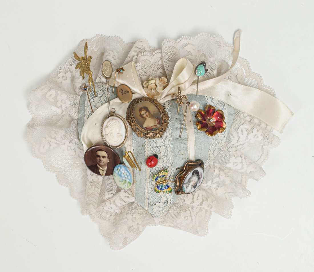 PIN CUSHION WITH AN ASSORTMENT OF PINS: PIN CUSHION WITH AN ASSORTMENT OF PINS: Various shapes and size of stick pins including 10K (6.2 grams), 14K (2.8 grams) and 18K (2.7 grams).