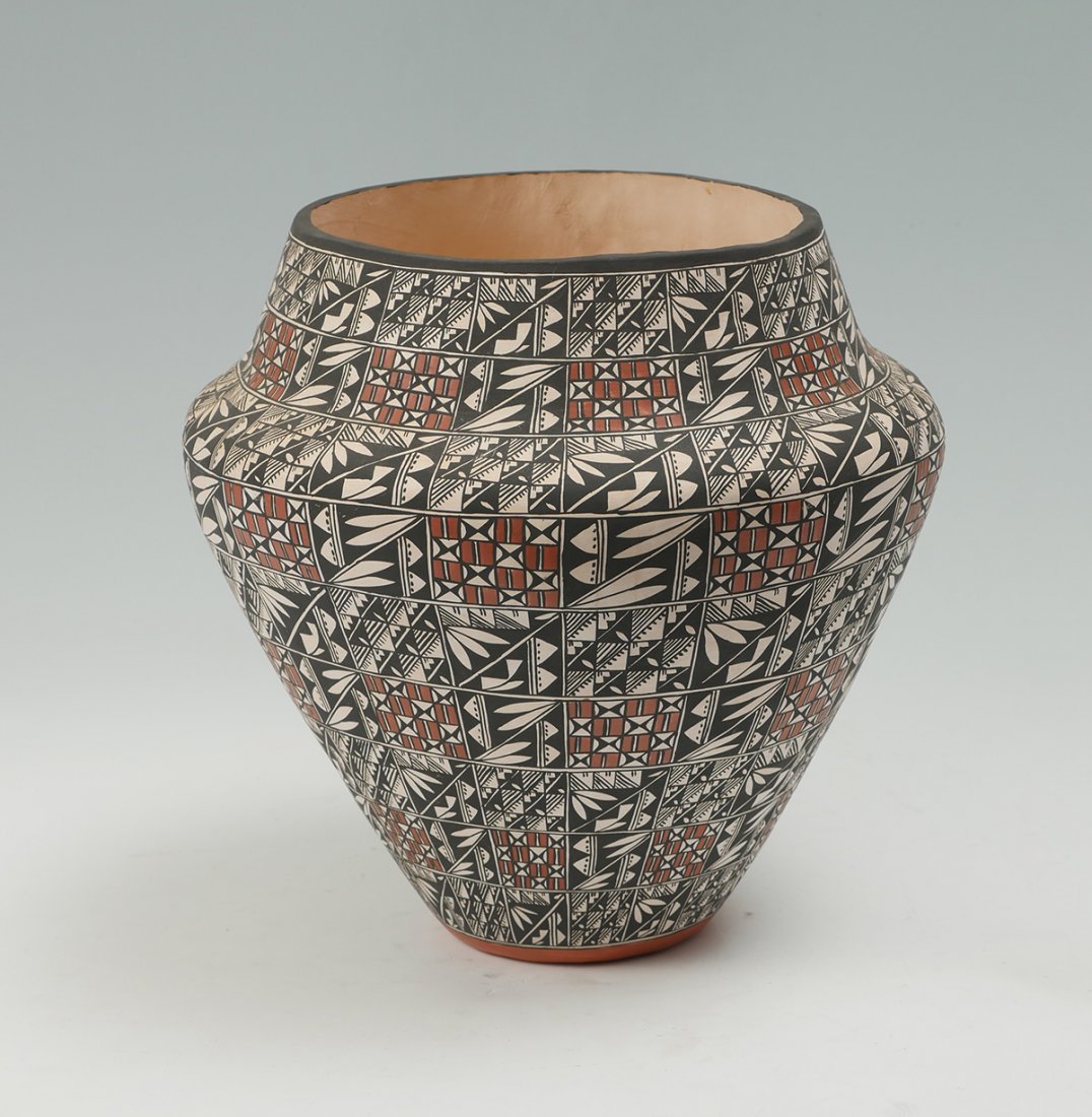 LARGE SOUTHWEST AMERICAN INDIAN ACOMA PUEBLO JAR: LARGE SOUTHWEST AMERICAN INDIAN ACOMA PUEBLO JAR: Large hand made Acoma, New Mexico jar/vase, having an encompassing polychrome geometrical design. Signed at underside, M. Stevens. Approx. 14.75" h x 