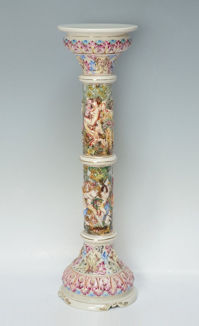 ITALIAN CAPODIMONTE PORCELAIN PEDESTAL: ITALIAN CAPODIMONTE PORCELAIN PEDESTAL: Italian Capodimonte porcelain pedestal, having overall cherub & nude female painted scenes with Bacchus masques & foliate designs at top & bottom. Underside rev