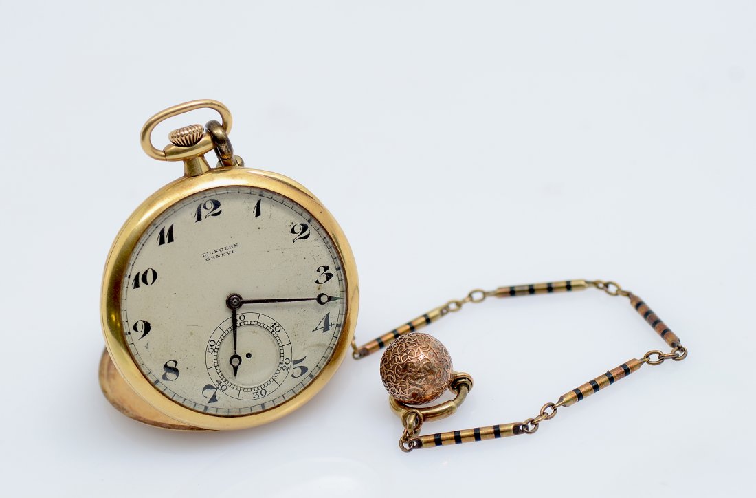 EDOUARD KOEHN 18K GOLD 18 JEWELL OPEN FACE POCKET WATCH: EDOUARD KOEHN 18K GOLD 18 JEWELL OPEN FACE POCKET WATCH: Serial # 86498. Works signed Ed Koehn, Geneve Swiss. 18k gold case marked 18K, 3466. Sold with a gold filled chain with attached ball. 39 MM.