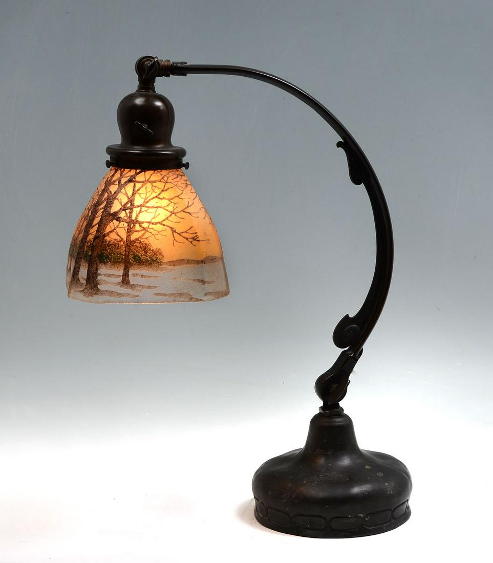 SIGNED HANDEL ART GLASS SHADE & BRONZE LAMP: SIGNED HANDEL ART GLASS SHADE & BRONZE LAMP: Bronze Handel adjustable base, signed on cloth tag at underside. Art glass shade, having an overall fall sunset overlay motif. Signed at interior of shade.