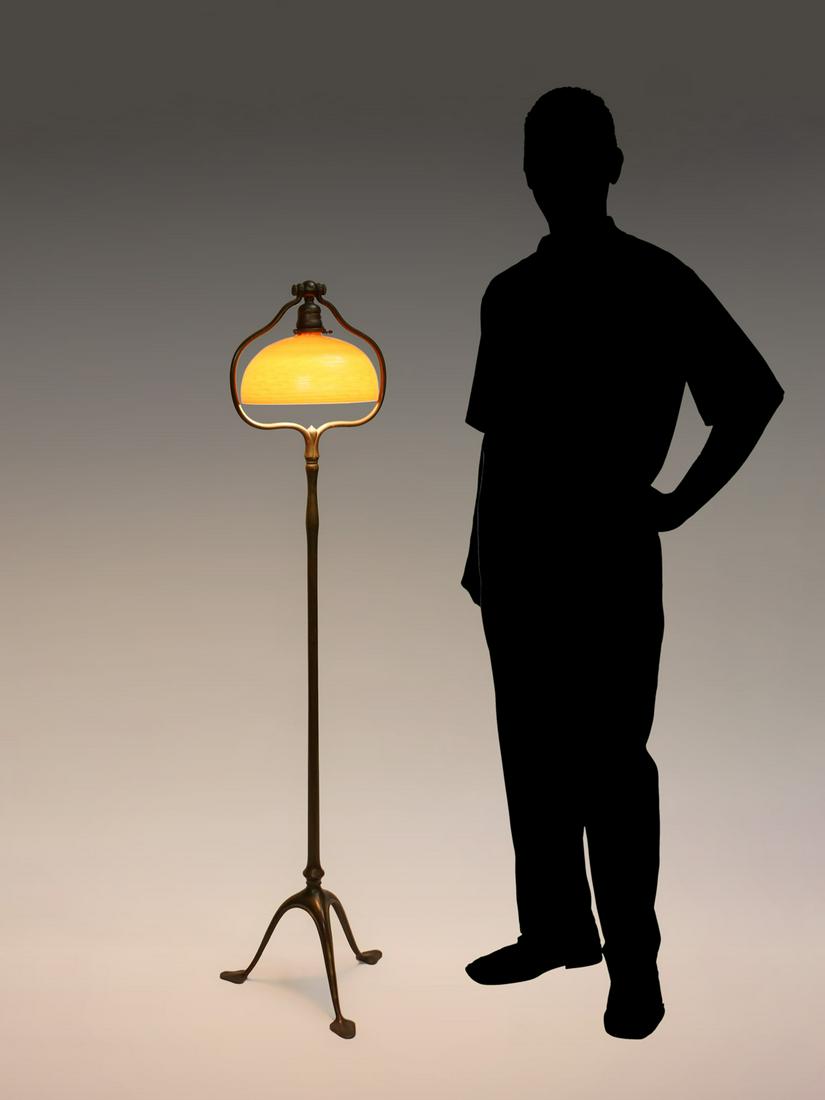 TIFFANY STUDIOS SIGNED BRONZE & ART GLASS FLOOR LA: TIFFANY STUDIOS SIGNED BRONZE & ART GLASS FLOOR LAMP: Tiffany bronze lamp base with three spade feet, signed under feet, Tiffany Studios, New York #423. Tiffany Gold Damascene art glass shade, signed 