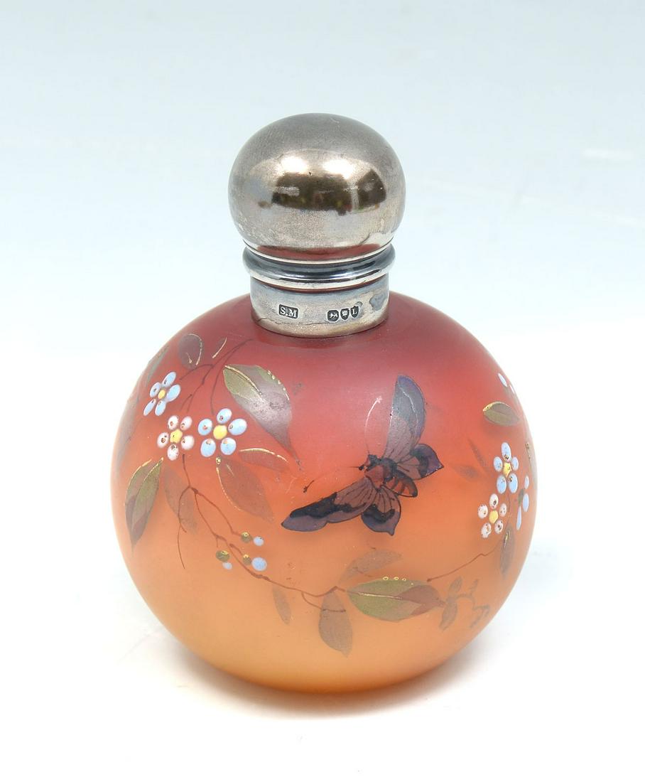 WEBB PEACH BLOW PERFUME BOTTLE WITH STERLING LID: WEBB PEACH BLOW PERFUME BOTTLE WITH STERLING LID: Thomas Webb peach blow art glass perfume bottle with a surmounting English sterling silver lid. Enameled floral & foliate motif. Lid has impressed Sam