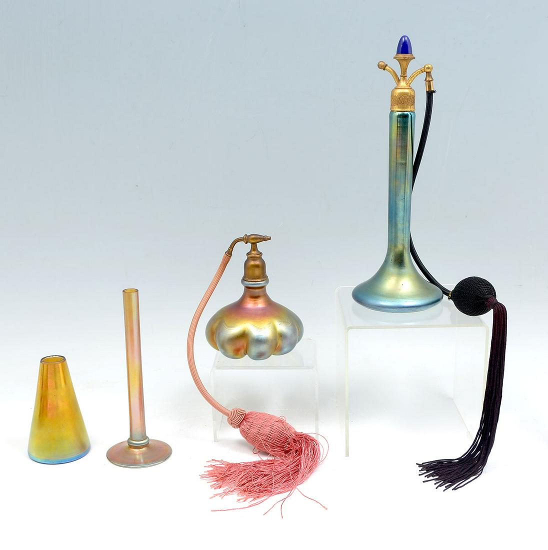4 PC. STEUBEN ART GLASS PERFUME & VASE COLLECTION: 4 PC. STEUBEN ART GLASS PERFUME & VASE COLLECTION: Comprising; 1- Tall gold & blue iridescent perfume bottle with atomizer. 1- Steuben quality squash form perfume bottle with atomizer. 1- Steuben art